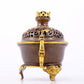 An exquisite gilt copper double-eared and tripod stove with 'auspicious clouds and chilong' patterns and a lid.