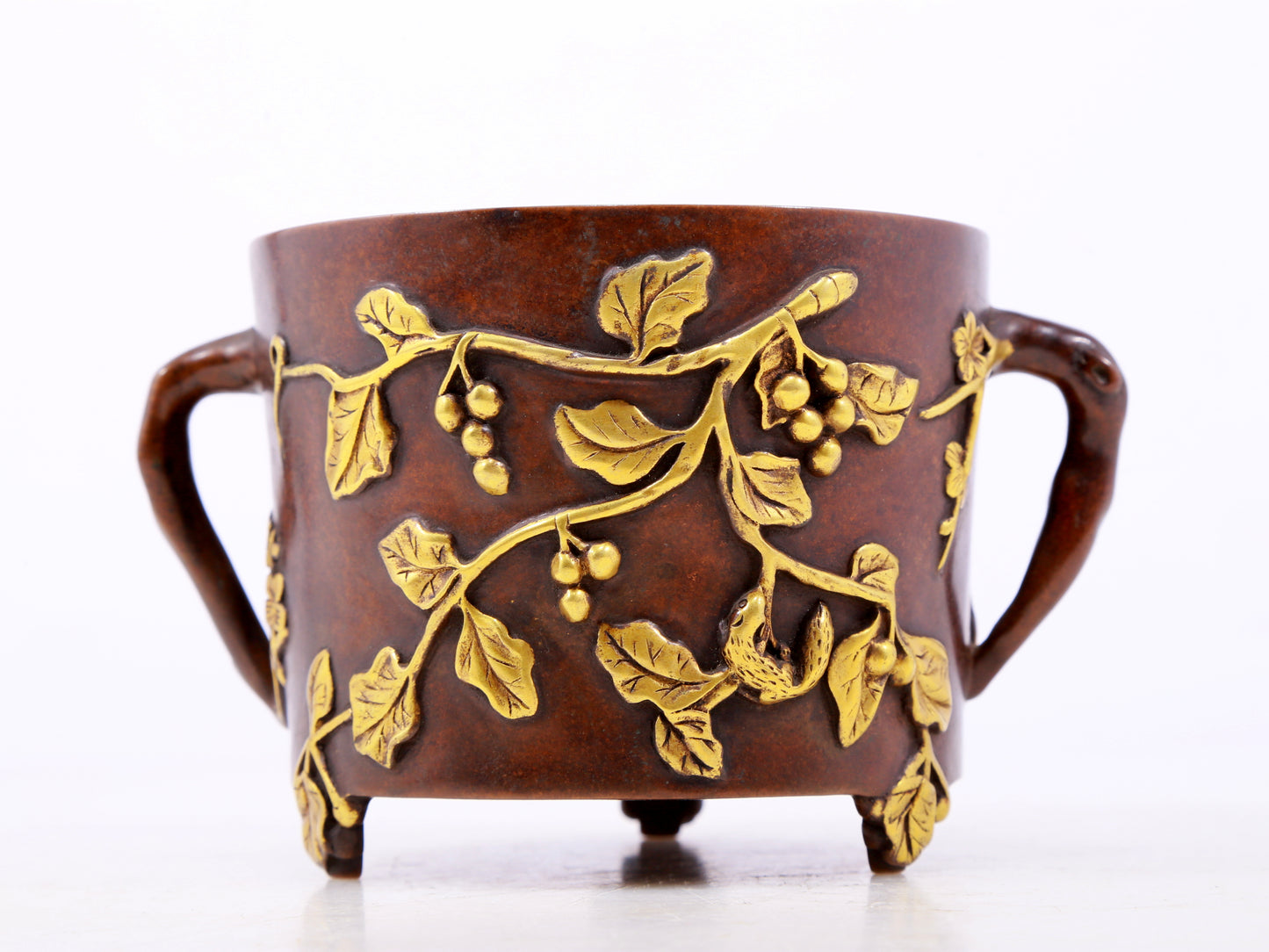 An exquisite gilt bronze censer with two ears and three legs with floral patterns