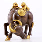 An exquisite gilt bronze boy herding cows