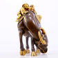 An exquisite gilt bronze boy herding cows