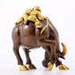 An exquisite gilt bronze boy herding cows