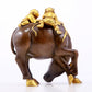 An exquisite gilt bronze boy herding cows