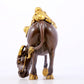 An exquisite gilt bronze boy herding cows