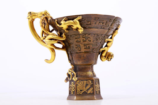 An exquisite gilt copper cup with dragon pattern