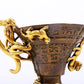 An exquisite gilt copper cup with dragon pattern