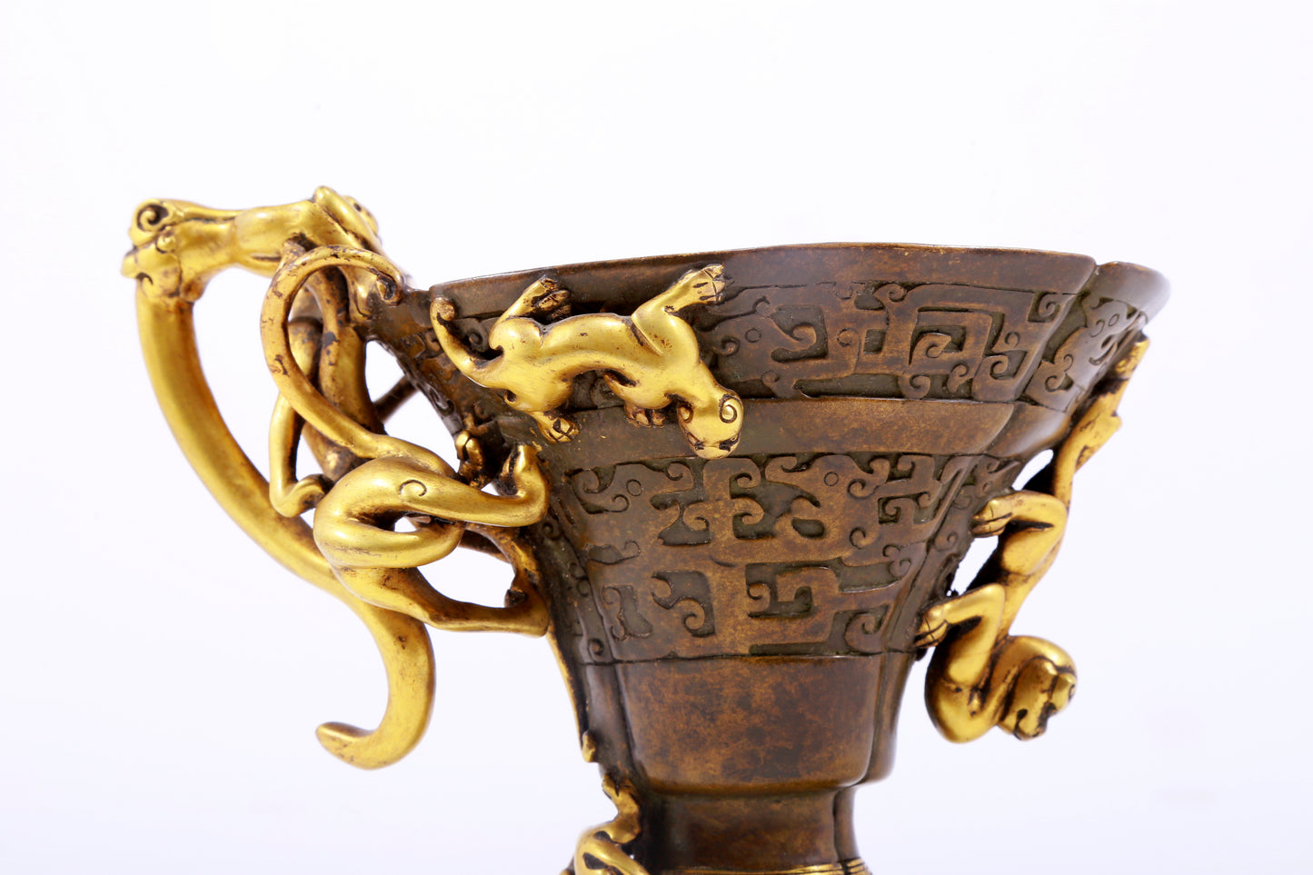 An exquisite gilt copper cup with dragon pattern