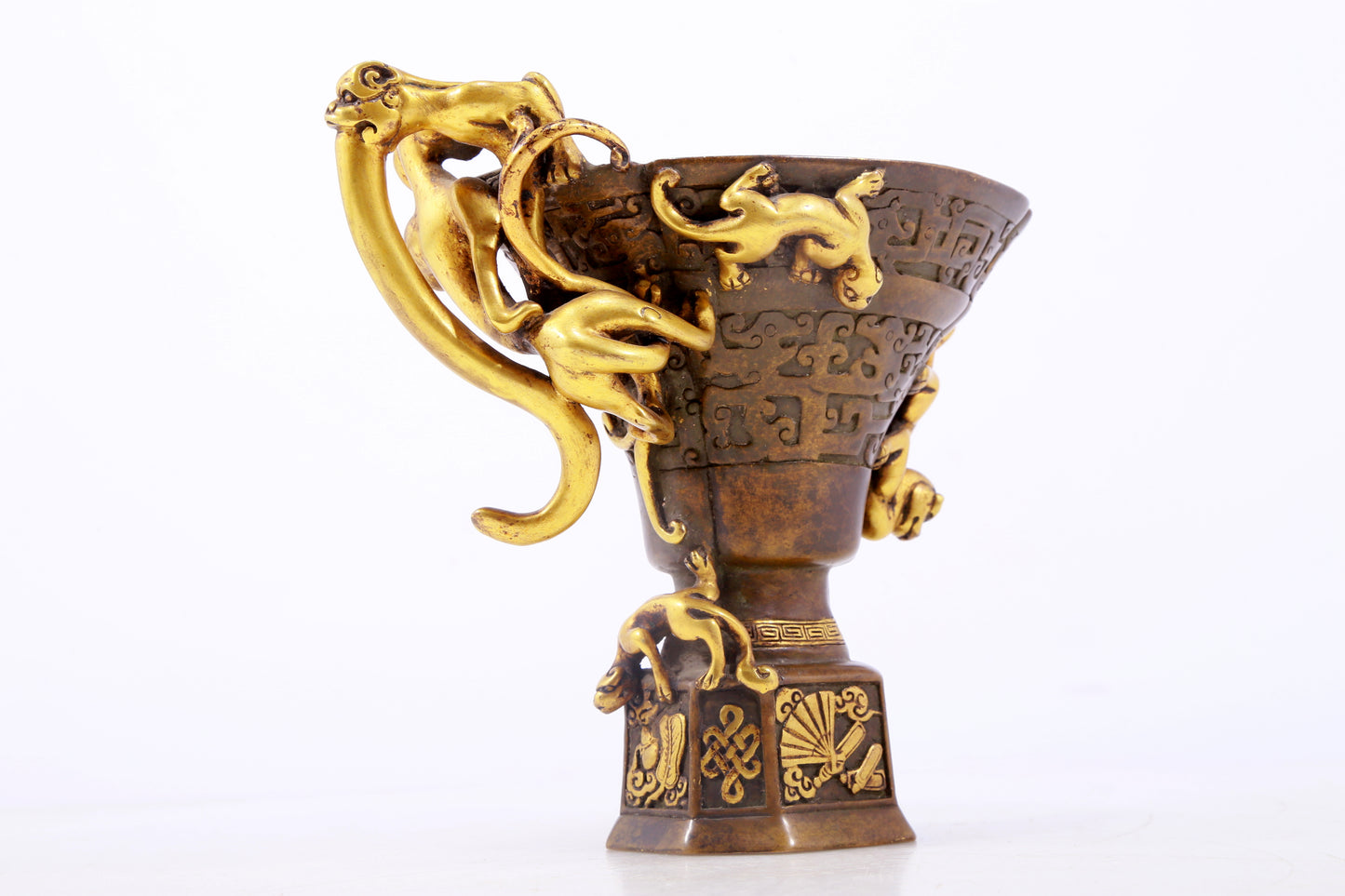 An exquisite gilt copper cup with dragon pattern