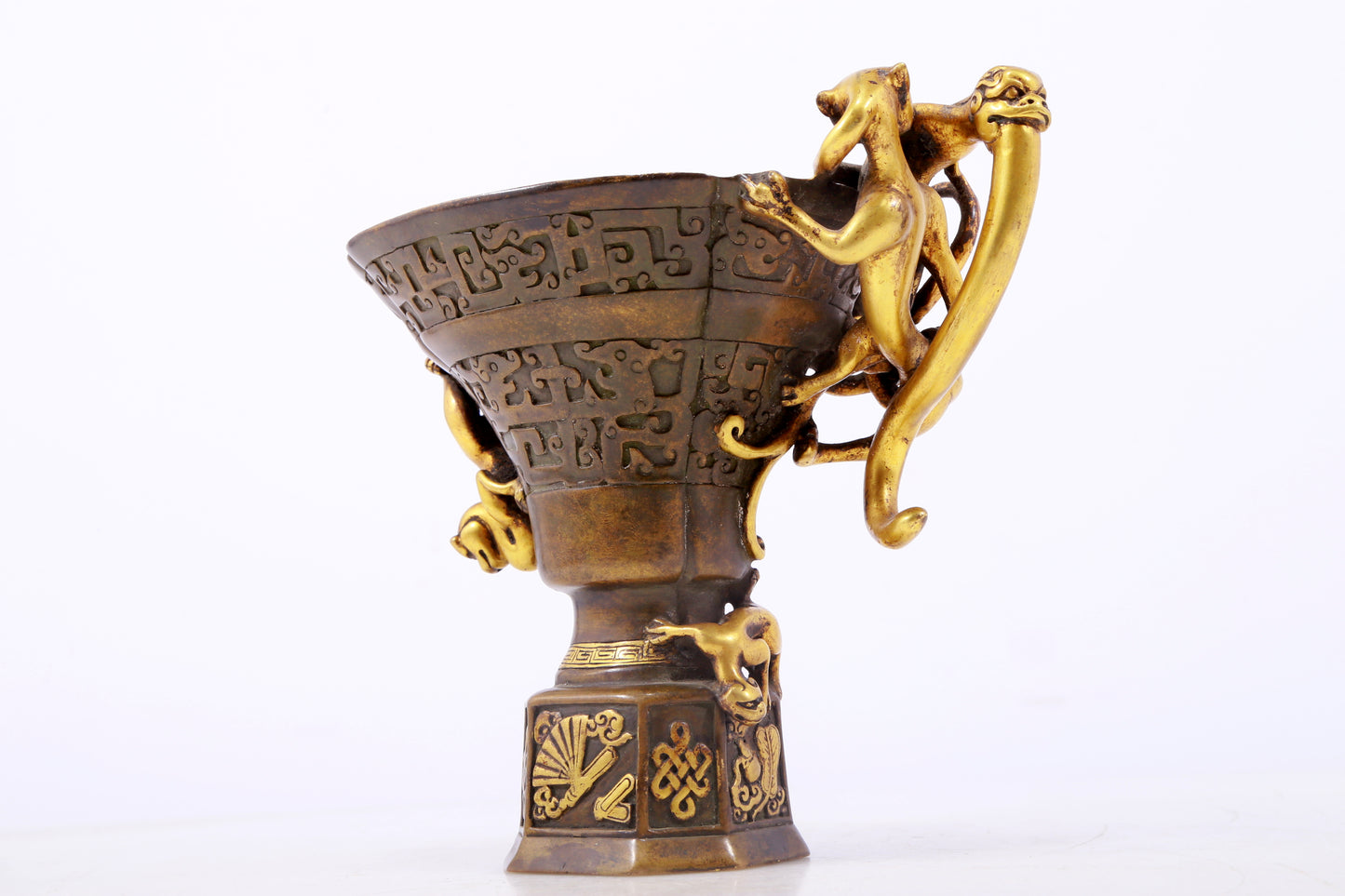 An exquisite gilt copper cup with dragon pattern