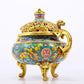 An exquisite cloisonné 'lily and dragon' pattern two-eared tripod censer with lid