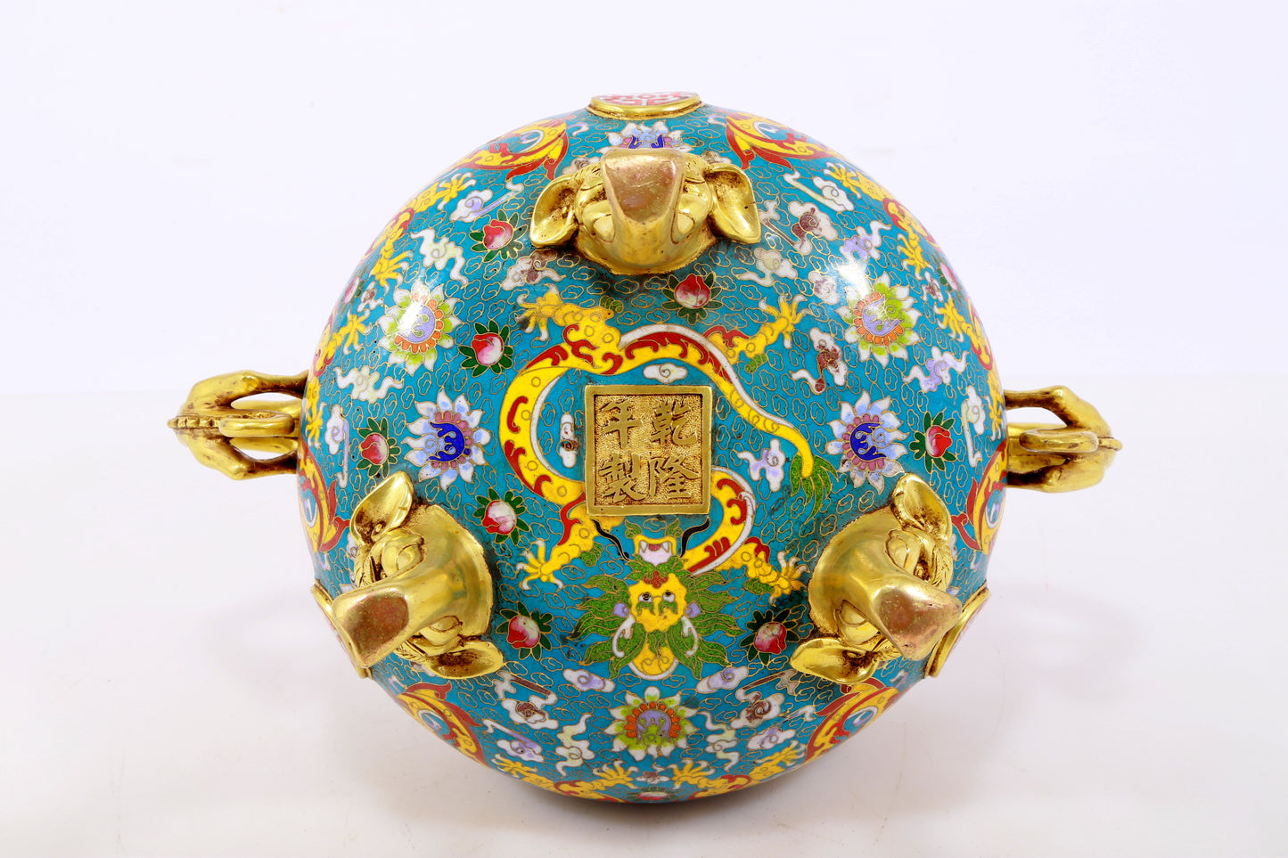 An exquisite cloisonné 'lily and dragon' pattern two-eared tripod censer with lid