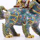 An exquisite cloisonné lion ornament