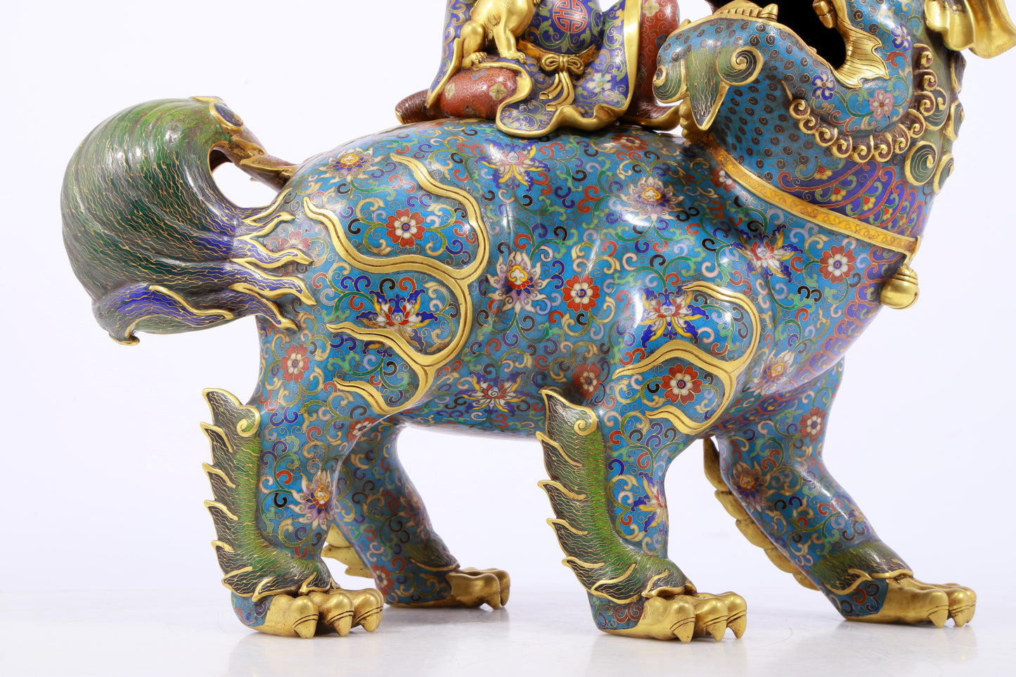 An exquisite cloisonné lion ornament