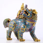 An exquisite cloisonné lion ornament