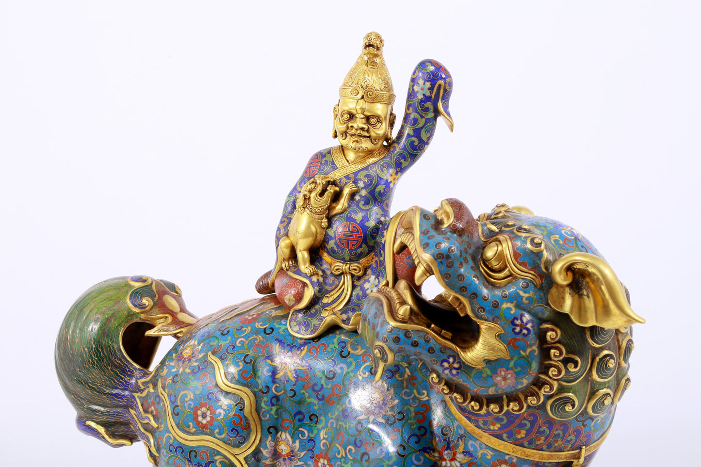 An exquisite cloisonné lion ornament