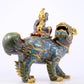 An exquisite cloisonné lion ornament