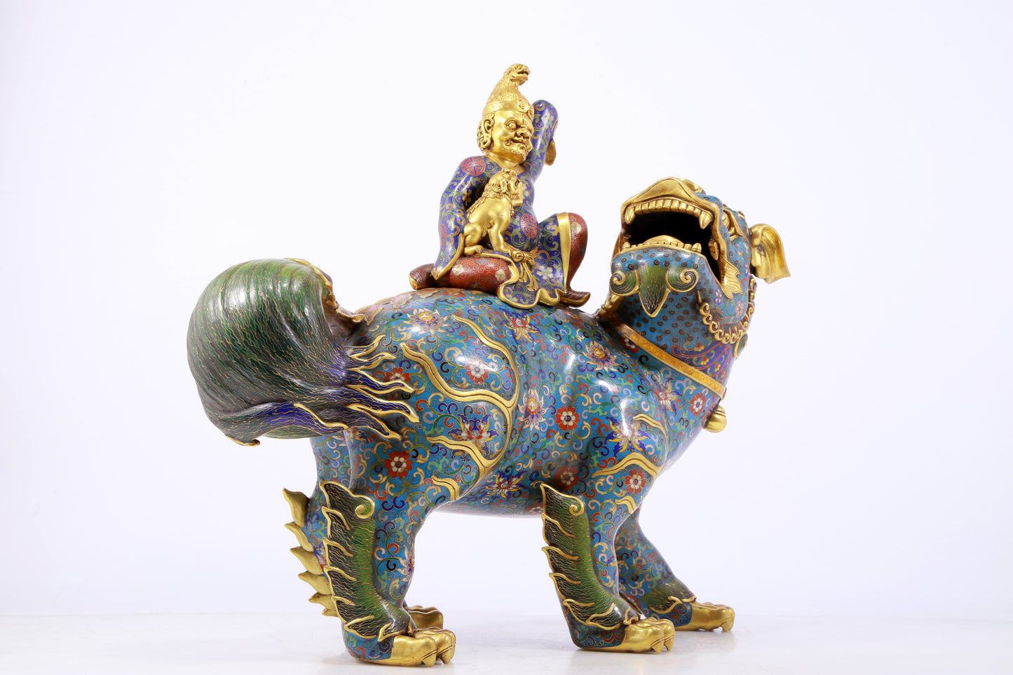 An exquisite cloisonné lion ornament