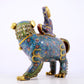 An exquisite cloisonné lion ornament