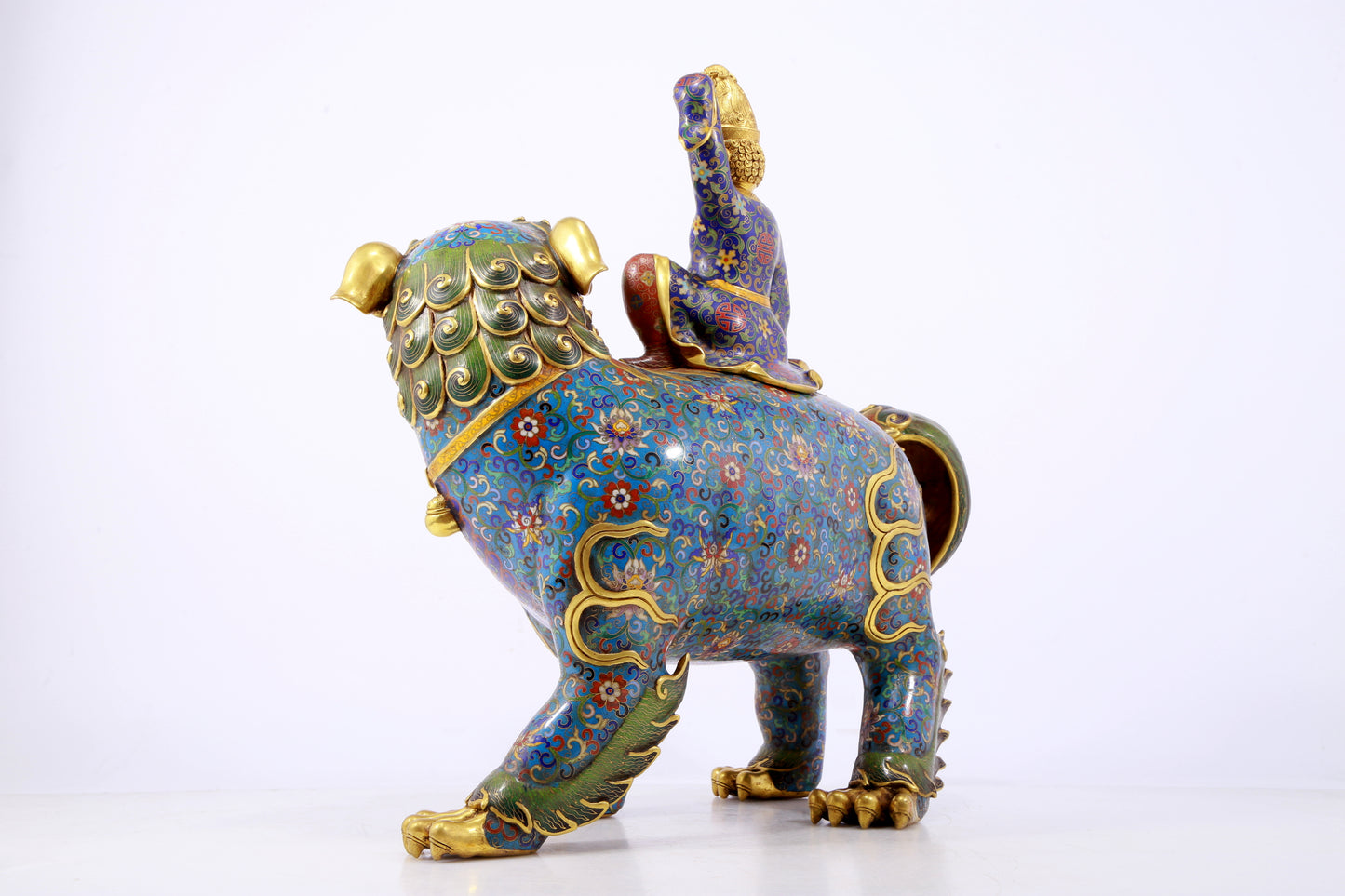 An exquisite cloisonné lion ornament