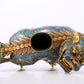 An exquisite cloisonné lion ornament