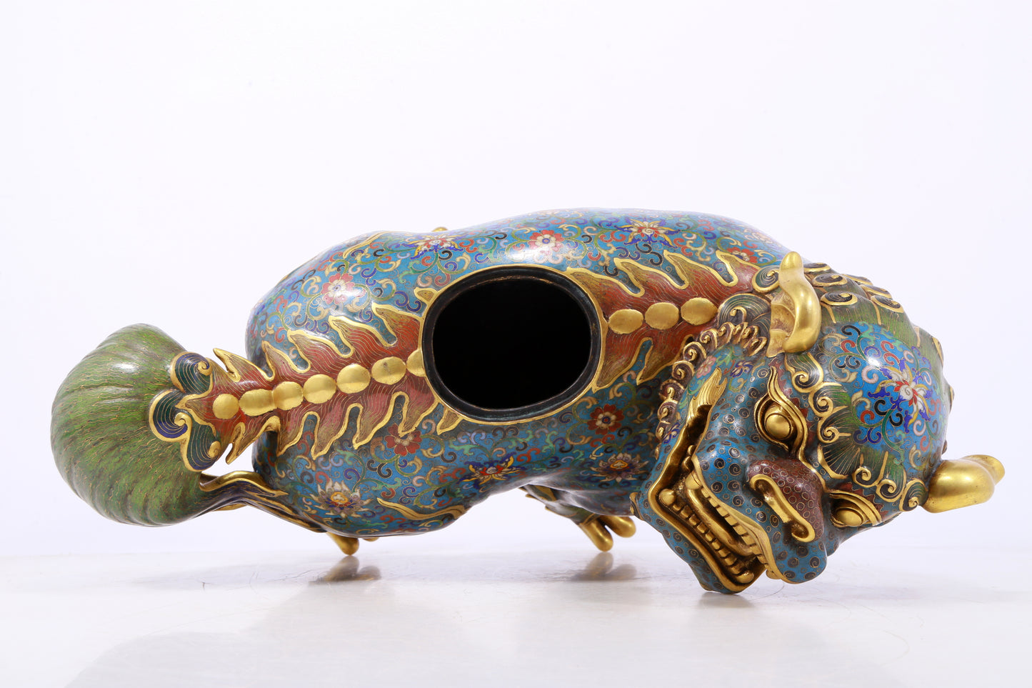 An exquisite cloisonné lion ornament