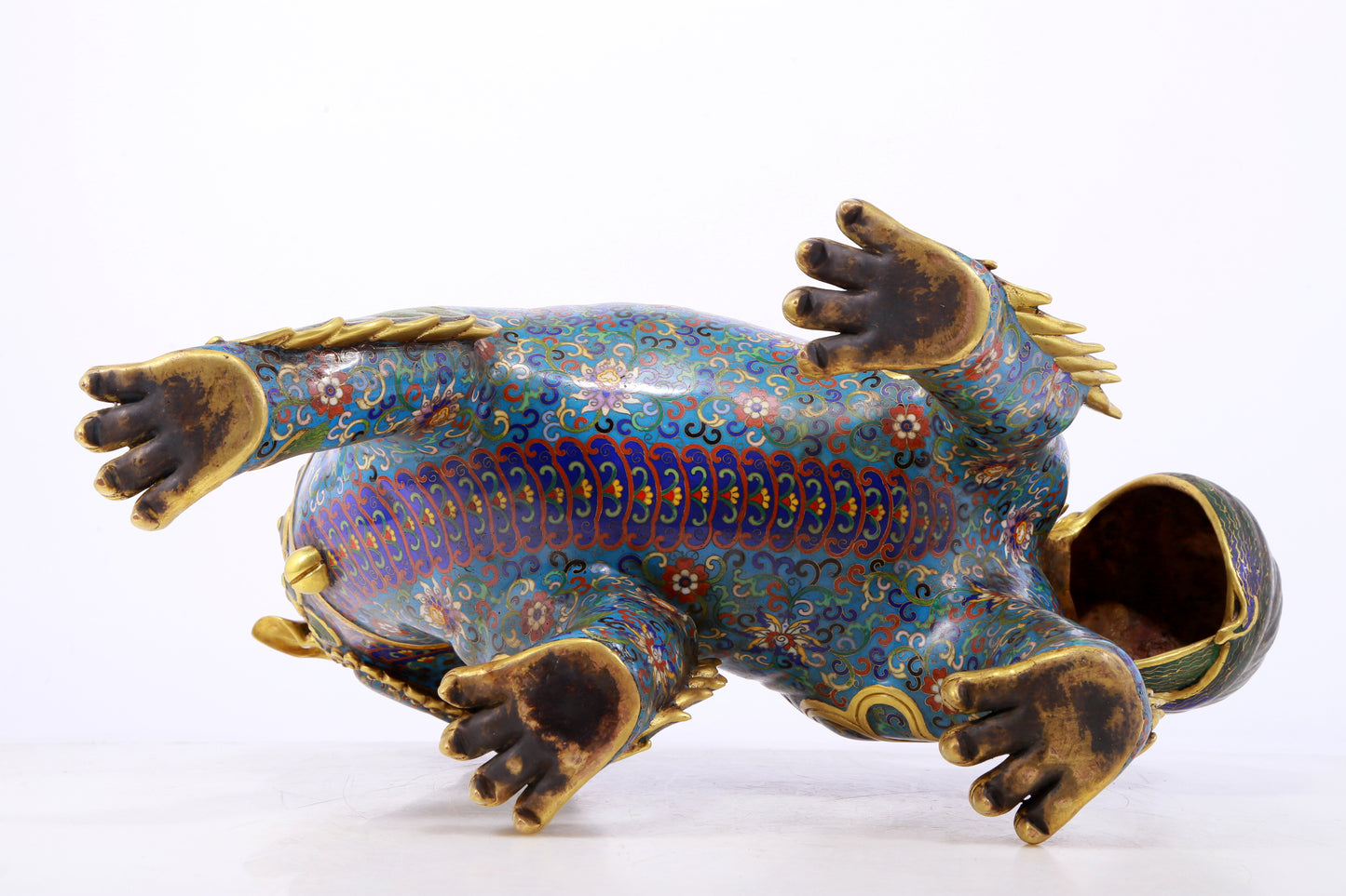 An exquisite cloisonné lion ornament