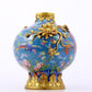 An exquisite cloisonné vase with flower and bird patterns