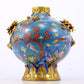 An exquisite cloisonné vase with flower and bird patterns