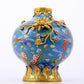 An exquisite cloisonné vase with flower and bird patterns