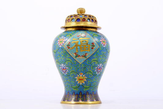 An exquisite cloisonne vase with lotus pattern and lid