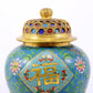 An exquisite cloisonne vase with lotus pattern and lid