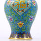 An exquisite cloisonne vase with lotus pattern and lid