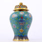 An exquisite cloisonne vase with lotus pattern and lid