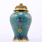 An exquisite cloisonne vase with lotus pattern and lid