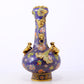 An exquisite cloisonné vase with 'flowers and auspicious animals' patterns