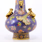 An exquisite cloisonné vase with 'flowers and auspicious animals' patterns