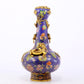 An exquisite cloisonné vase with 'flowers and auspicious animals' patterns