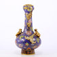 An exquisite cloisonné vase with 'flowers and auspicious animals' patterns