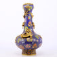 An exquisite cloisonné vase with 'flowers and auspicious animals' patterns