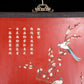 An exquisite zitanwood lacquered hanging screen with flower and bird patterns inlaid with gemstones