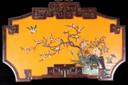 An exquisite lacquered huanghuali wood hanging screen with flower and bird patterns inlaid with gemstones