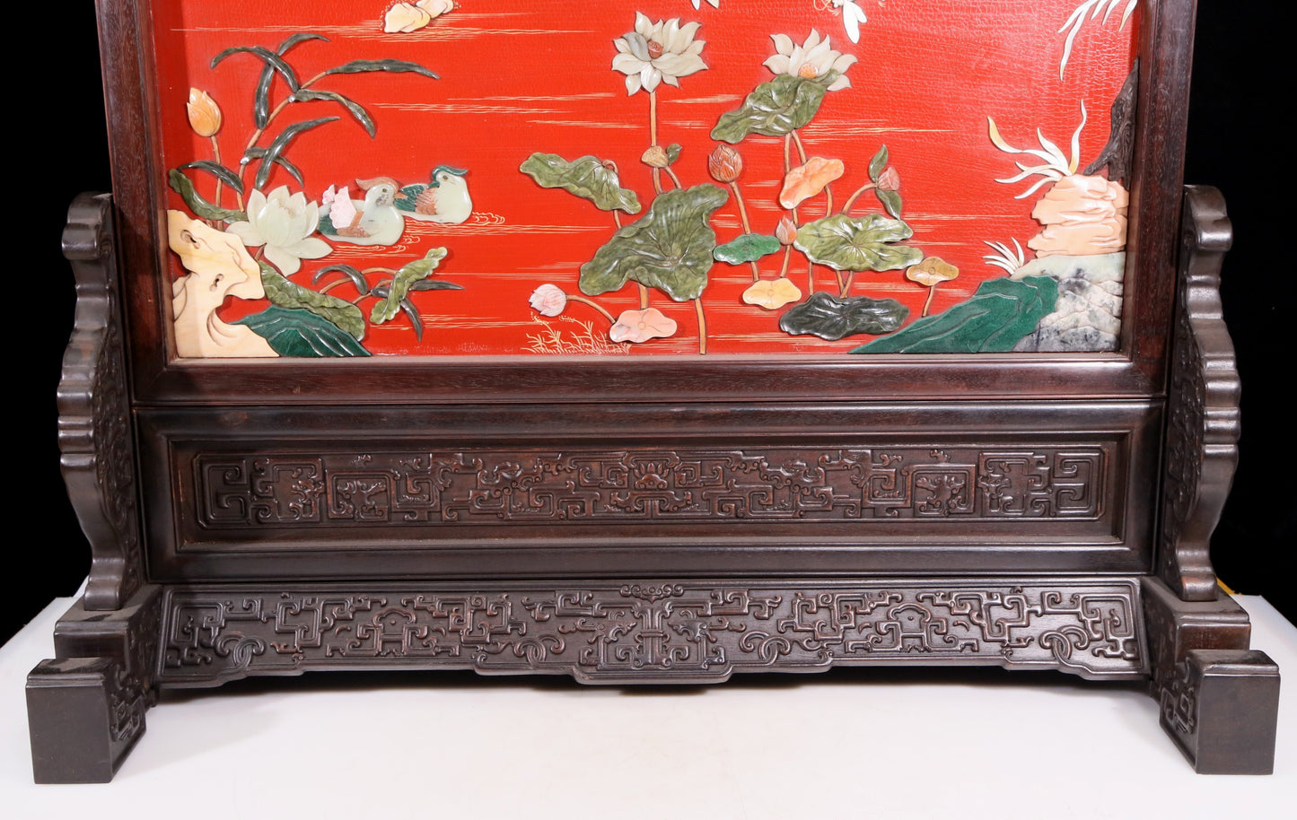 An exquisite zitanwood lacquered, gold-embedded, flower-and-bird pattern table screen