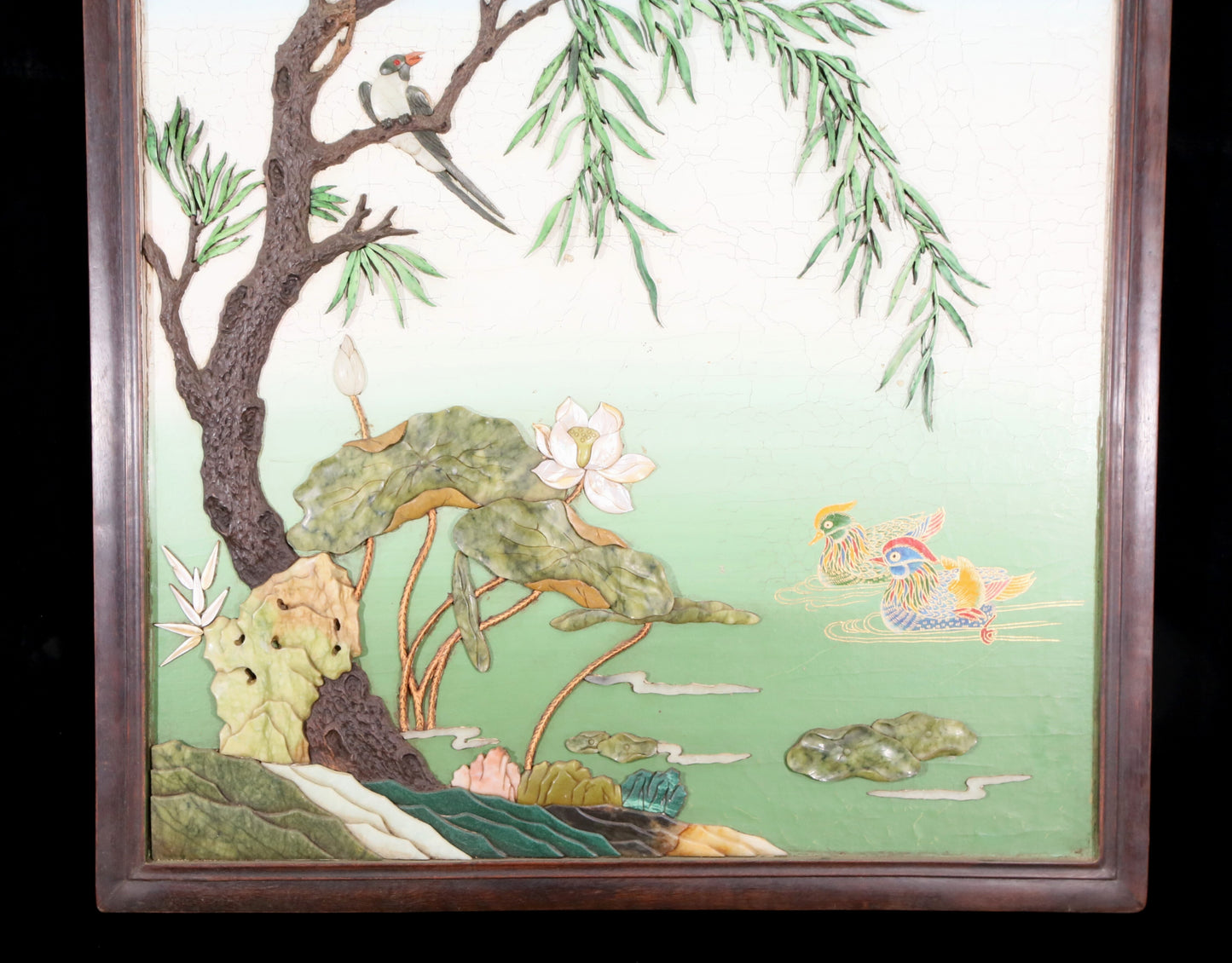 An exquisite zitanwood painted and painted hanging screen with inlaid gems and landscapes, flowers and birds.