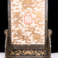 An exquisite zitanwood lacquered table screen with gold floral and dragon patterns