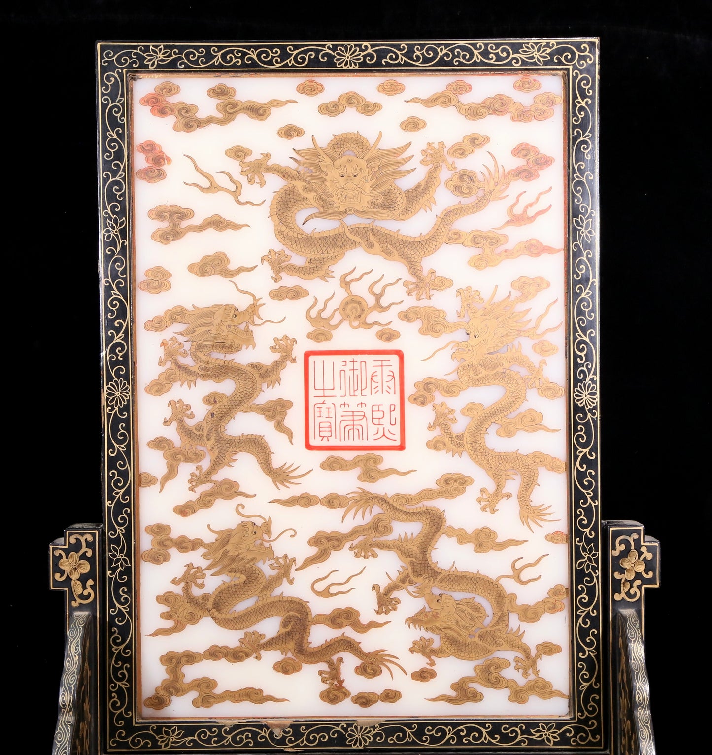 An exquisite zitanwood lacquered table screen with gold floral and dragon patterns