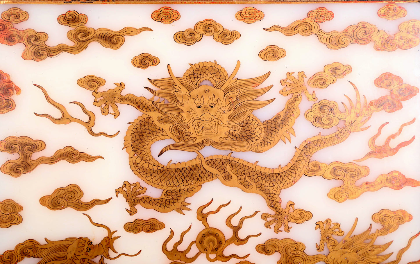 An exquisite zitanwood lacquered table screen with gold floral and dragon patterns