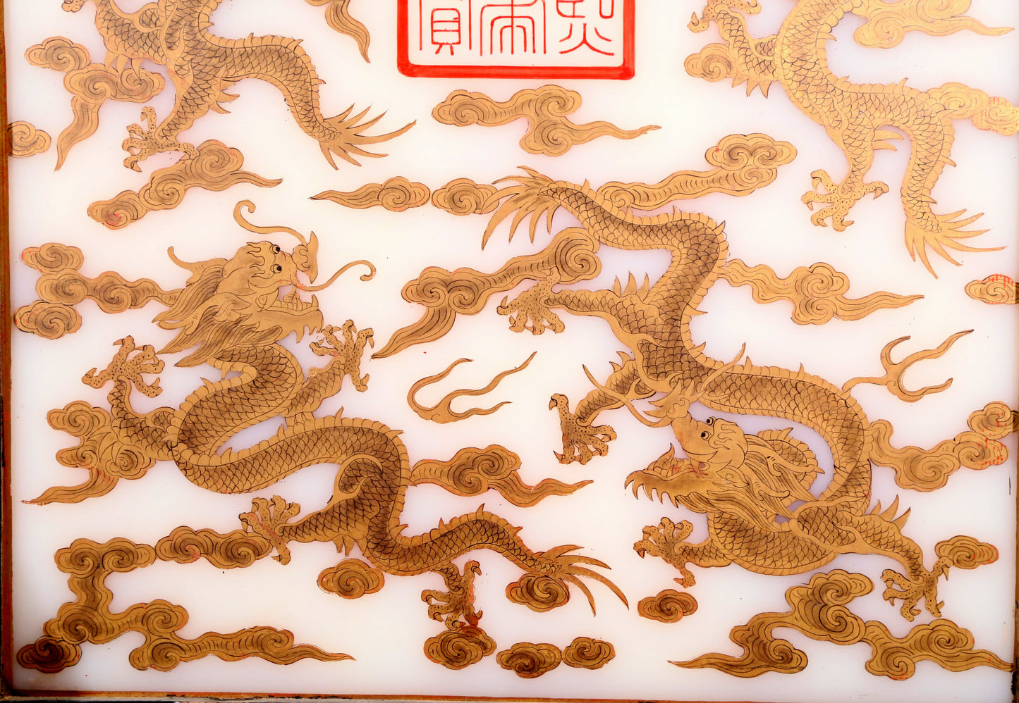 An exquisite zitanwood lacquered table screen with gold floral and dragon patterns