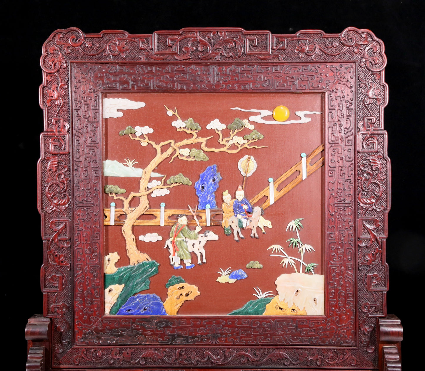 An exquisite huanghuali wood lacquered, gold-embedded, landscape and figure table screen