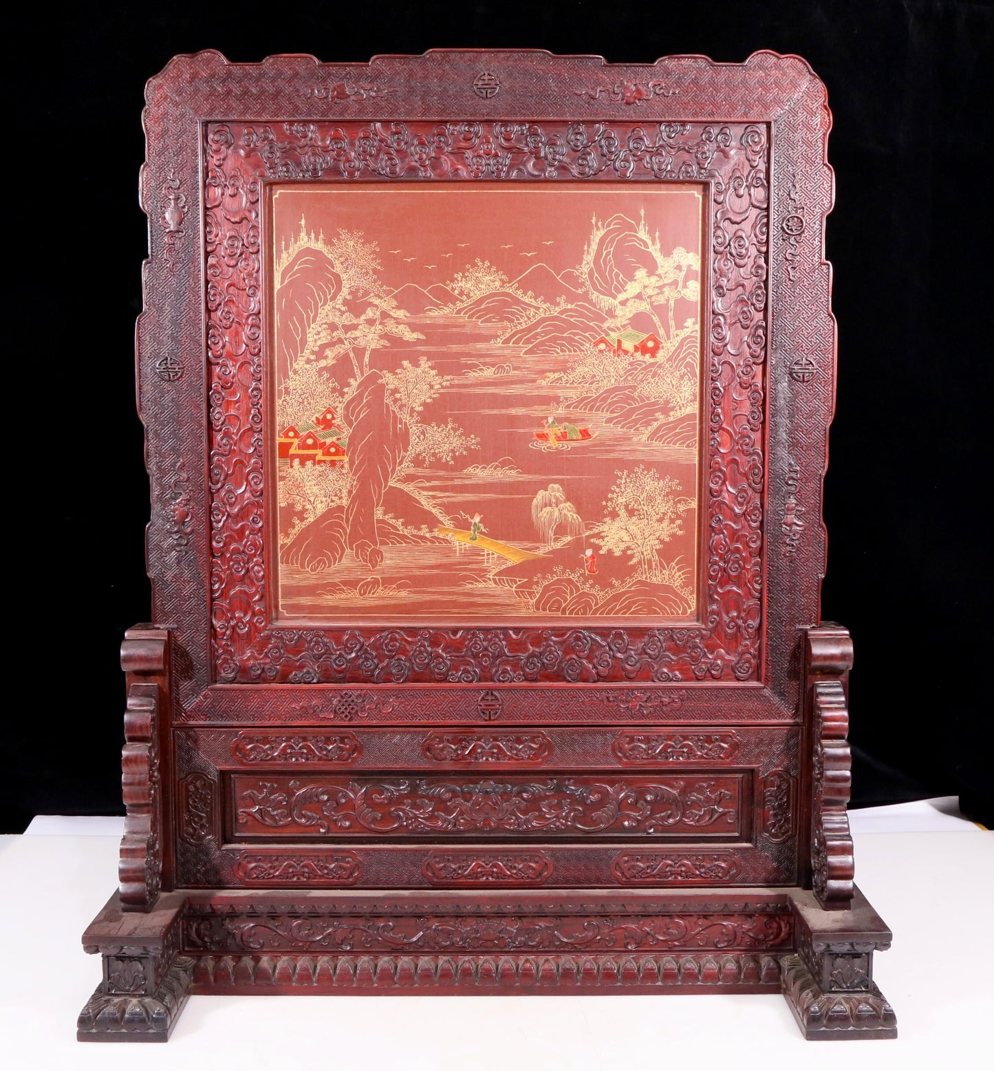 An exquisite huanghuali wood lacquered, gold-embedded, landscape and figure table screen