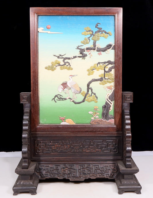 An exquisite zitanwood lacquered and gold-embedded pine and crane pattern table screen