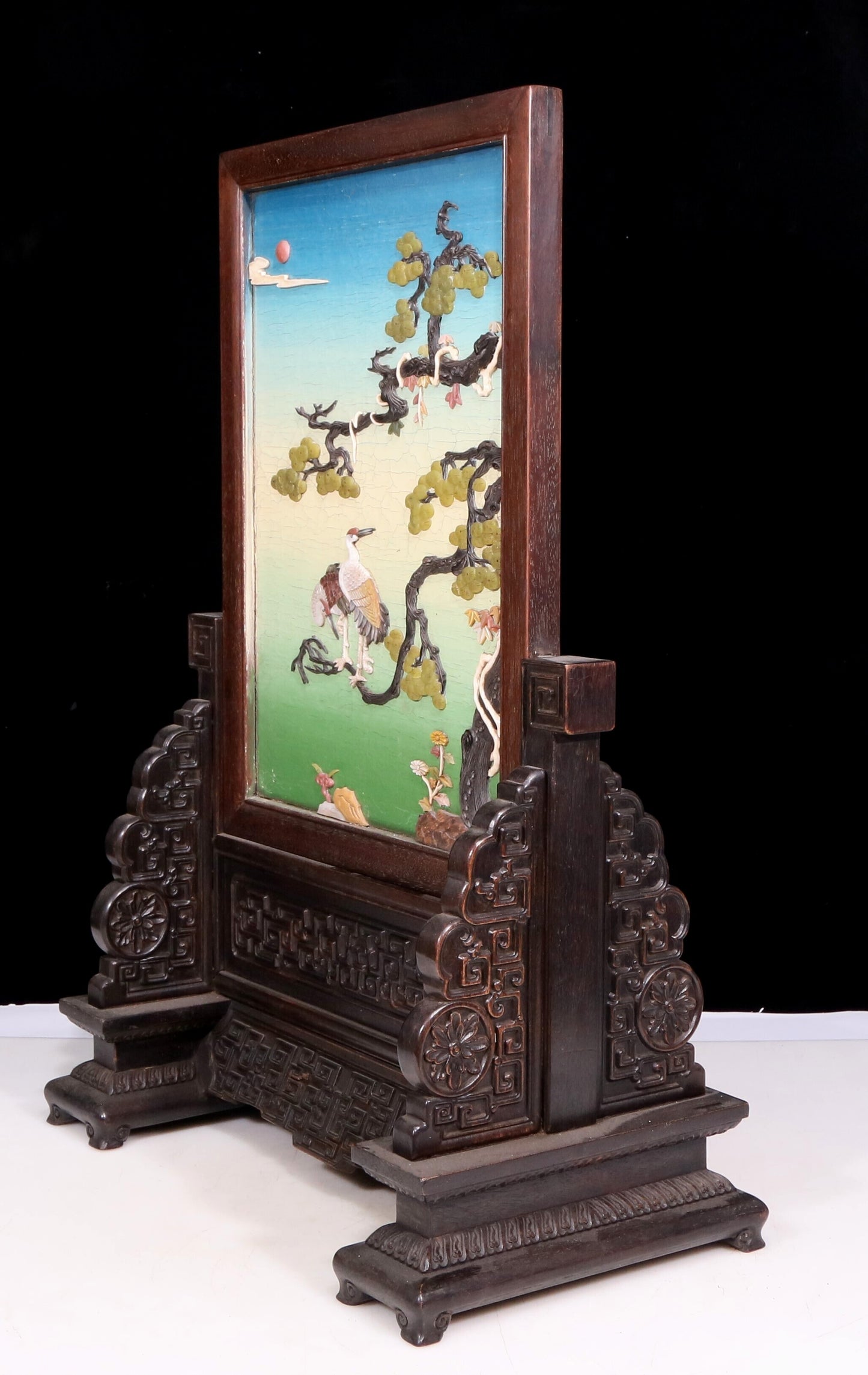 An exquisite zitanwood lacquered and gold-embedded pine and crane pattern table screen